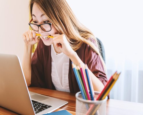 Person drinking water at office desk