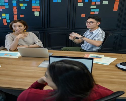 Team members discussing lifestyle content
